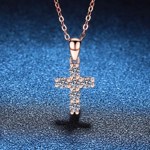 Rose gold cross pendant necklace featuring brilliant round-cut moissanite stones