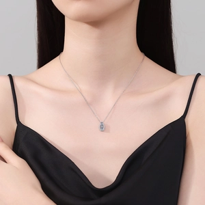 Elegant 925 sterling silver necklace with water drop moissanite pendant on model neck