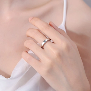 Polished S925 sterling silver moissanite ring worn by a model for elegant engagement look