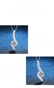 Macro shot of S-shaped silver pendant with a round-cut Moissanite stone and polished finish