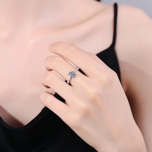 Elegant S925 sterling silver ring with 1 carat round moissanite on a woman's finger