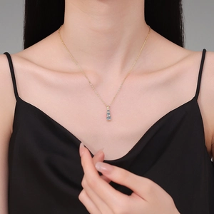 Elegant 925 sterling silver necklace with three blue moissanite stones on gold chain
