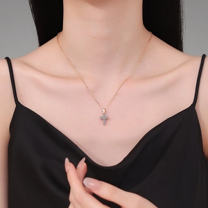 925 silver necklace with rose gold cross pendant and light blue moissanite gemstone