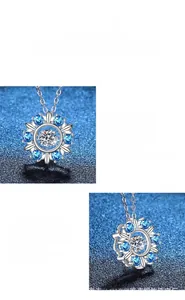 Detailed view of the snowflake moissanite pendant with high polish and blue accent stones