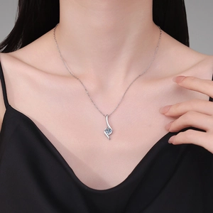 Elegant S925 sterling silver necklace featuring a round blue moissanite pendant on model