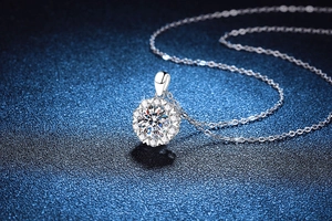 Macro detail of S925 sterling silver snowflake pendant with sparkling moissanite main stone