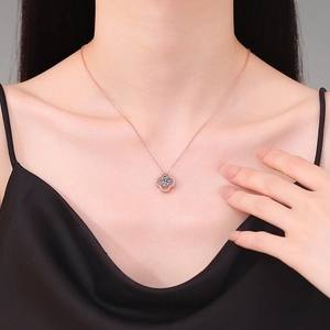 Elegant 1ct D color Moissanite four-leaf clover pendant necklace in rose gold on model