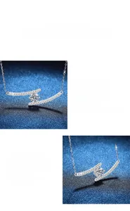 Macro detail of 925 silver moissanite pendant with double arc design and sparkling stones