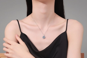 Close-up of S925 sterling silver snowflake necklace with 2-carat Moissanite on a model