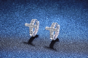 Close-up of S925 sterling silver cross earrings with shimmering moissanite stones