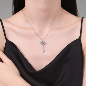 S925 sterling silver twilight key pendant necklace with moissanite on a model