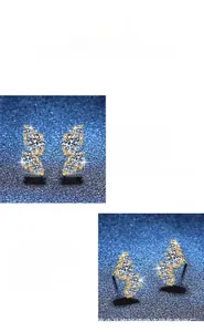 Dettaglio macro di orecchini in moissanite taglio a pera con montatura dorata lucida