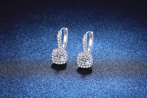 Macro shot of 1ct cushion-cut moissanite halo earrings in sparkling S925 silver