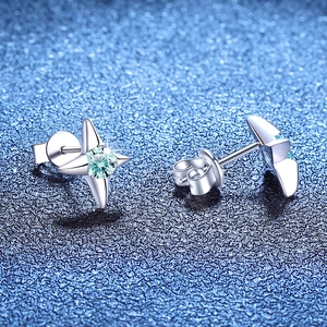 S925 sterling silver star stud earrings with blue moissanite on dark blue starry background