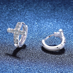 Sparkling S925 sterling silver cross hoop earrings with moissanite accents on blue background