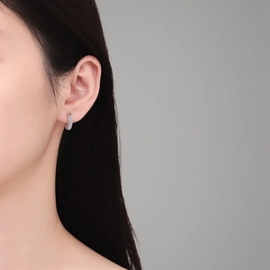 Elegant s925 silver hoop earrings with triple-row moissanite diamonds on a female model