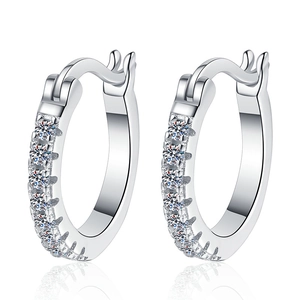 Elegant S925 sterling silver huggie earrings with round moissanite stones in a minimalist style
