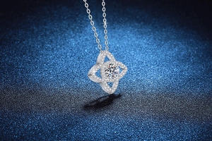Detail of 925 sterling silver lotus star pendant with 1ct moissanite and pave stones