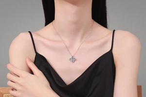 Detailed view of a 925 silver necklace with a 1 carat moissanite lotus pendant on a model