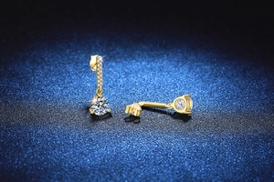 Macro shot of 2-carat Moissanite tassel earrings in gold-plated S925 sterling silver