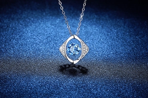 Macro shot of 925 silver dancing stone necklace with blue moissanite in geometric frame
