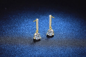 Detailed macro view of 2ct moissanite drop earrings in gold plated S925 sterling silver