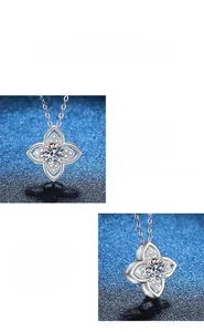 Vue macro de la moissanite de 1 carat et des détails polis du collier trèfle