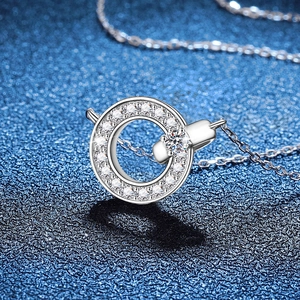 925 sterling silver moissanite necklace with round halo pendant on a dark blue background