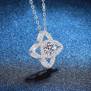 925 sterling silver lotus star necklace with 1 carat moissanite pendant on blue background