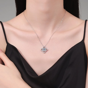 Elegant 925 sterling silver lotus necklace with 1 carat moissanite on a female model