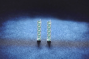 Vertical S925 silver stud earrings featuring five cyan blue moissanite stones