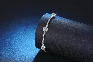Close-up of S925 silver rope chain bracelet with three sparkling moissanite stones