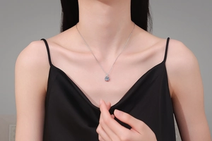 Close-up of 1ct D color moissanite pendant on a minimalist 925 silver chain necklace