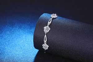 Detailed macro view of 925 silver bracelet featuring floral motifs and sparkling moissanite