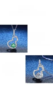 Makroaufnahme des S925 Silber-Kürbis-Anhängers mit grünen und weißen Moissanit-Steinen