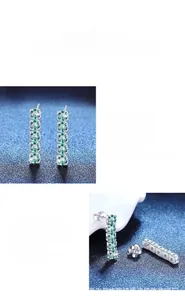 Detail of S925 silver earrings with five blue moissanite stones in a claw setting