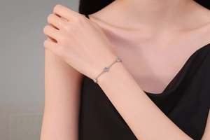 Close-up of S925 sterling silver moissanite bubble bracelet on woman's wrist