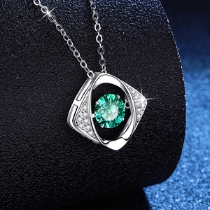 S925 silver 1ct green moissanite necklace with geometric heart pendant on blue stand