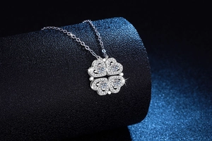 Close-up of S925 sterling silver four-leaf clover pendant with sparkling moissanite stones