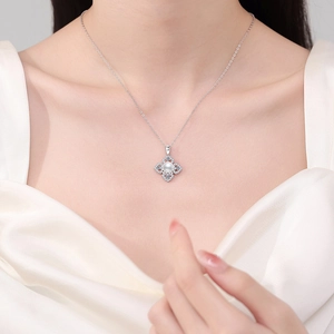 Elegant S925 silver necklace with camellia clover pendant and freshwater pearl on model