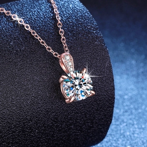 Elegant 1 carat Moissanite pendant necklace with four-prong setting and rose gold finish