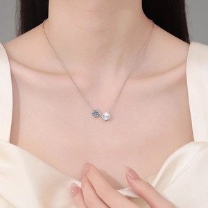 Elegant S925 sterling silver necklace featuring a freshwater pearl and moissanite pendant