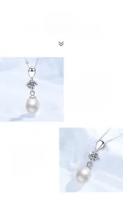 Detailed view of sterling silver pendant with round moissanite and teardrop pearl charm