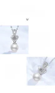 Detail of heart-shaped s925 silver pendant with moissanite and 8mm freshwater pearl