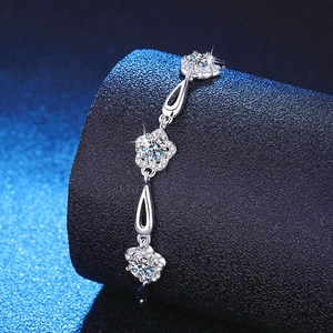 Elegant 925 sterling silver bracelet featuring 1.5ct moissanite stars on black leather stand