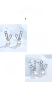 Detailed macro view of S925 silver rabbit stud earrings with moissanite and pearls