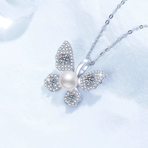 Elegant S925 sterling silver butterfly necklace featuring a white pearl and sparkling crystals