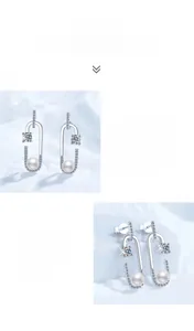 Gros plan détaillé sur la boucle d'oreille trombone en argent S925 avec moissanite et perle