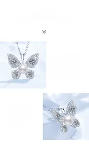 Macro shot of butterfly pendant with fresh water pearl and moissanite stones