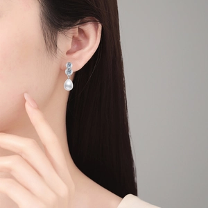 Elegant S925 silver earrings featuring sparkling moissanite and teardrop freshwater pearls